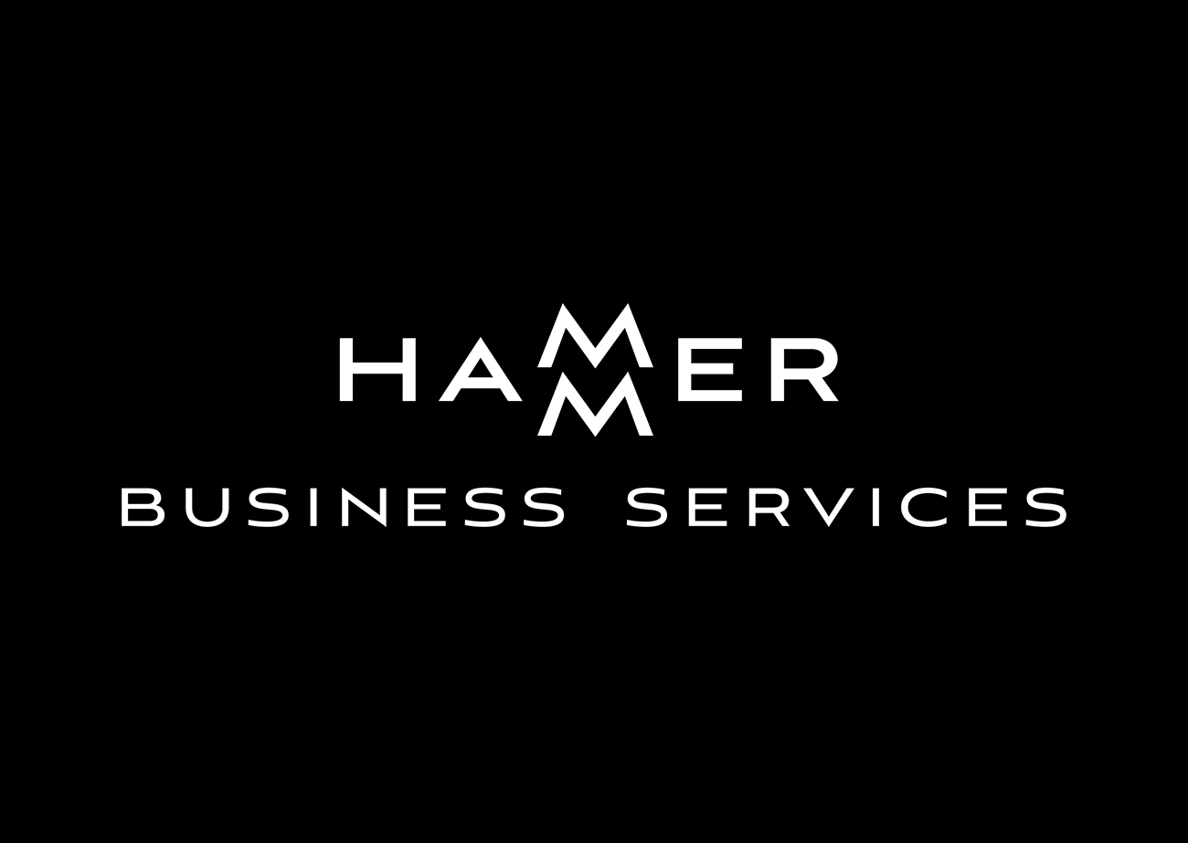 Logo that consists of business name in white sans serif upper case letters against a black background. The word HAMMER is on the first line. The two letter Ms are stacked one atop the other, centered between the HA and the ER. The second line says BUSINESS SERVICES.